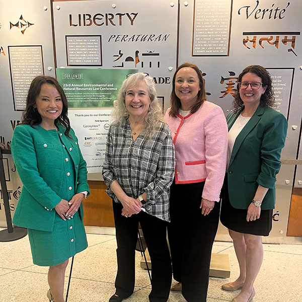 Sonni Williamson, Jane McBride, Emily Masalski, Sarah Toney standing in front of a display