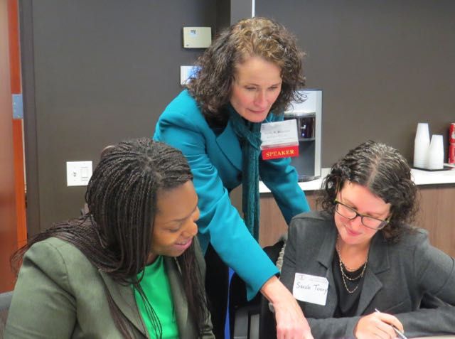 Jayne Reardon, Executive Director of the Illinois Supreme Court Commission on Professionalism, works with mentee Carolyn Muhammad and mentor Sarah Toney.
